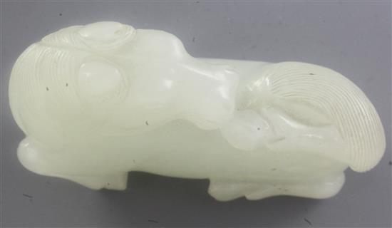 A Chinese white jade figure of a recumbent horse, 18th / 19th century, length 5.4cm